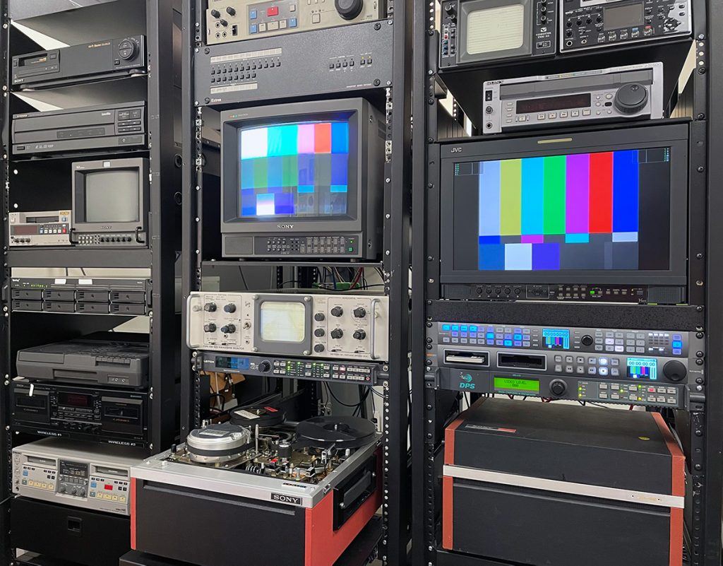 Three AV racks with video equipment.