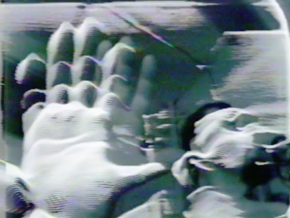 Abstract video image with hand prints.