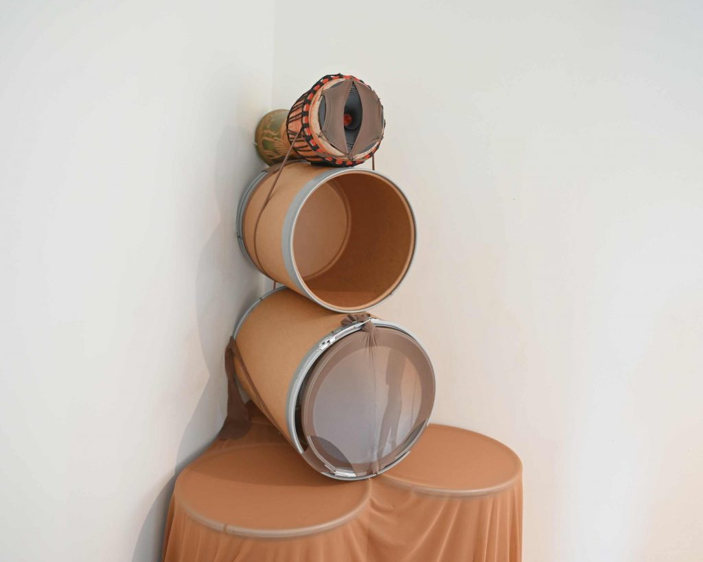 Drums stacked on each other in an installation.